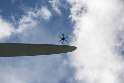 A SkySpecs' autonomous drone inspects wind turbine blades safely, efficiently and quickly.