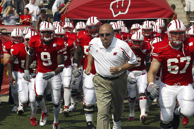 Madison, Wisconsin - 9/6/2003. University of Wisconsin head coach Barry Alvarez leads his team onto the field before the Akron game at Camp Randall. Wisconsin beat Akron 48-31. (C)David Stluka.