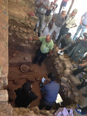 Archaeologists and media gathered at the newly discovered burial site in Copan.