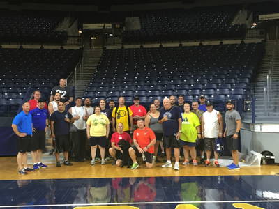 Wounded Warrior Project veterans pose for a picture after touring Notre Dame and working out with their trainers.