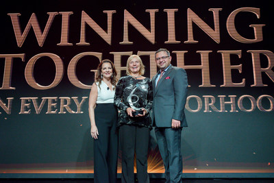 Applebee's executives honor Bonnie Lippincott on stage as The 2016 Operator of the Year Award winner in Beverly Hills on Sept. 29, pictured left to right: Julia Stewart, President, Applebee's; Bonnie Lippincott, Chief Operating Officer, The Rose Group; Sanjiv Razdan, SVP of Operations, Applebee's.