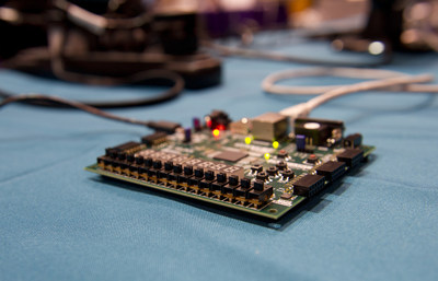 Finalists in the 2015 CSAW Embedded Security Contest brought their research as well as programmable computer boards to see if they could hack into an example of what may well become the next generation of voting systems, protected by homomorphic encryption.
