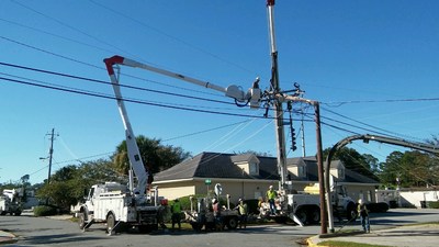 Crews work to restore power in Coastal Georgia following Hurricane Matthew. Georgia Power announced Thursday that it had restored power to more than 99 percent of customers impacted by the storm.