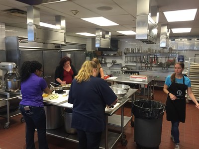 Wounded Warrior Project Alumni make their way around a kitchen during a physical health and wellness class in Pittsburgh.