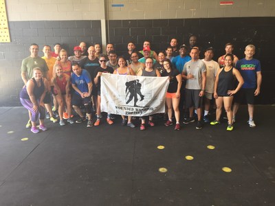 Warriors pose after a day of fitness training hosted by Wounded Warrior Project.