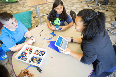 Carla Mendoza Lopez, right, with (L-R) Mason Mulkey and Amrutha Mantha, use IBM Watson Element for Educators, the first IBM MobileFirst for iOS app for the education industry, at Coppell's Richard Lee Elementary School in Coppell, Texas, on Weds., October 19, 2016. Coppell Independent School District, one of the top ranked public school systems in Texas, is the first school district to use the app for enhanced personal interactions and learning experiences for students. (Courtesy of IBM)