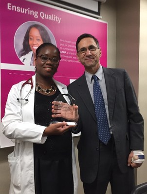 Robert Lyon, MD, Chief Medical Director at MHS Health Wisconsin, presents the 9th Annual Summit Award to Lillian Oduwole, an Advanced Practice Nurse Prescriber and board-certified Family Nurse Practitioner. Oduwole sees patients at Outreach Community Health Center in Milwaukee. The award acknowledges healthcare professionals for providing exemplary care and clinical excellence to MHS Health members throughout Wisconsin.