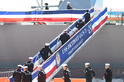 Sailors assigned to the Freedom-variant littoral combat ship USS Detroit (LCS 7) man their ship and bring her to life during the commissioning ceremony on the Detroit River on Oct. 22. Photo credit: Lockheed Martin.