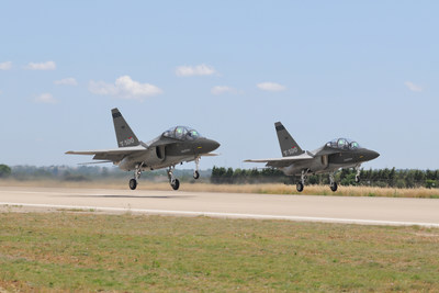 A pair of T-100 jet trainers taking off