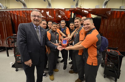 FTC President David Ruggieri, left, with members of the college's first Construction Trade and Technology program.