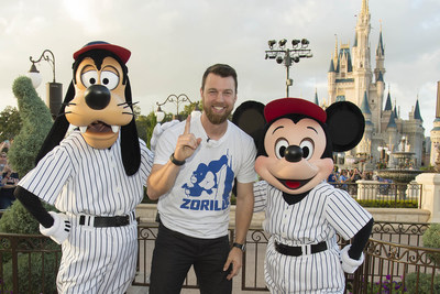 MVP Ben Zobrist of the Chicago Cubs poses for a victory photo with Goofy and Mickey Mouse Saturday, Nov. 5, 2016, at Magic Kingdom Park in Lake Buena Vista, Fla. The players were later honored among thousands of fans in a parade at Walt Disney World celebrating the team's historic victory. (Preston Mack, photographer)