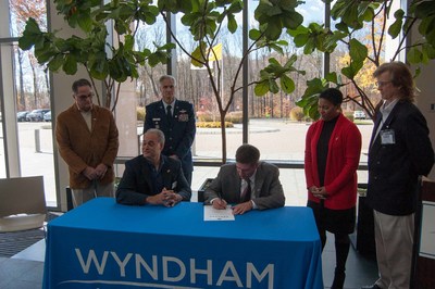 Wyndham Worldwide associates and representatives of the Employer Support of the Guard and Reserve (ESGR) gather as Wyndham Worldwide signs the ESGR Statement of Support in Parsippany, N.J. on November 11, 2016.