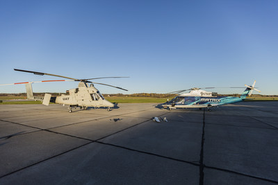 The unmanned K-MAX (left) and the optionally-piloted Sikorsky Autonomy Research Aircraft (SARA) (right) participated in a collaborative firefighting demonstration with the Indago (front left) and Desert Hawk 3.1 (front right). Photo courtesy Lockheed Martin.