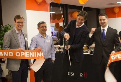 ObserveIT CEO Mike McKee (center) cuts the ribbon at the grand opening of the company's new world headquarters with (at left) Board members David Friend and Deepak Taneja and (right) Boston City Councilor Josh Zakim