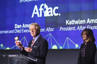 Aflac CEO Dan Amos displays the 2016 Aflac Holiday Duck along side Aflac Foundation President Kathelen Amos, while addressing The Washington Post's "Chasing Cancer" event in Washington, DC. Purchase a holiday duck at participating Macy's stores with all the net proceeds going to fight childhood cancer.