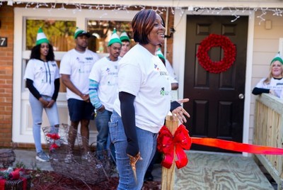U.S. Army veteran Missy Melvin, who is establishing a veteran care facility in Decatur, Ga., Open Hearts Residential Living Center, prepares to cut the ribbon for a new accessibility ramp built at her center through funding from the Sears Heroes at Home for the Holidays program. As part of its long-standing commitment to supporting veterans and military families, Sears brought back its Heroes at Home program for the holiday season to immediately assist in building dozens of wheelchair accessibility ramps at the homes of low-income veterans before Christmas.
