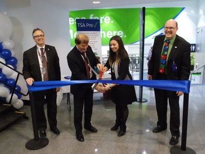 Representatives from Cleveland Hopkins International Airport and Vacation Express celebrate the new flights with a ribbon cutting ceremony.