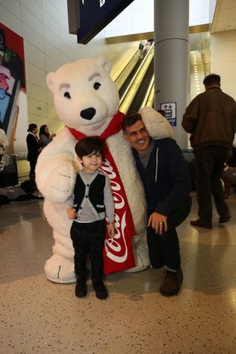 Dallas Fort Worth International Airport and Coca-Cola(R) Surprise Travelers with Holiday Cheer