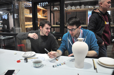 Journalists visiting from abroad at Taoxichuan Ceramic Art Avenue, Jingdezhen