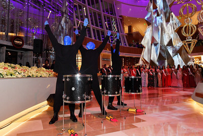 Blue Man Group performs in The Conservatory at MGM National Harbor as two dozen Miss World contestants look on, at the resort's grand opening party.